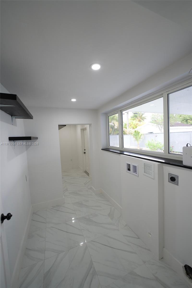 10381 Southwest 32nd Street Miami, FL 33165 - Photo 20 of 38 a view of an empty room with a window