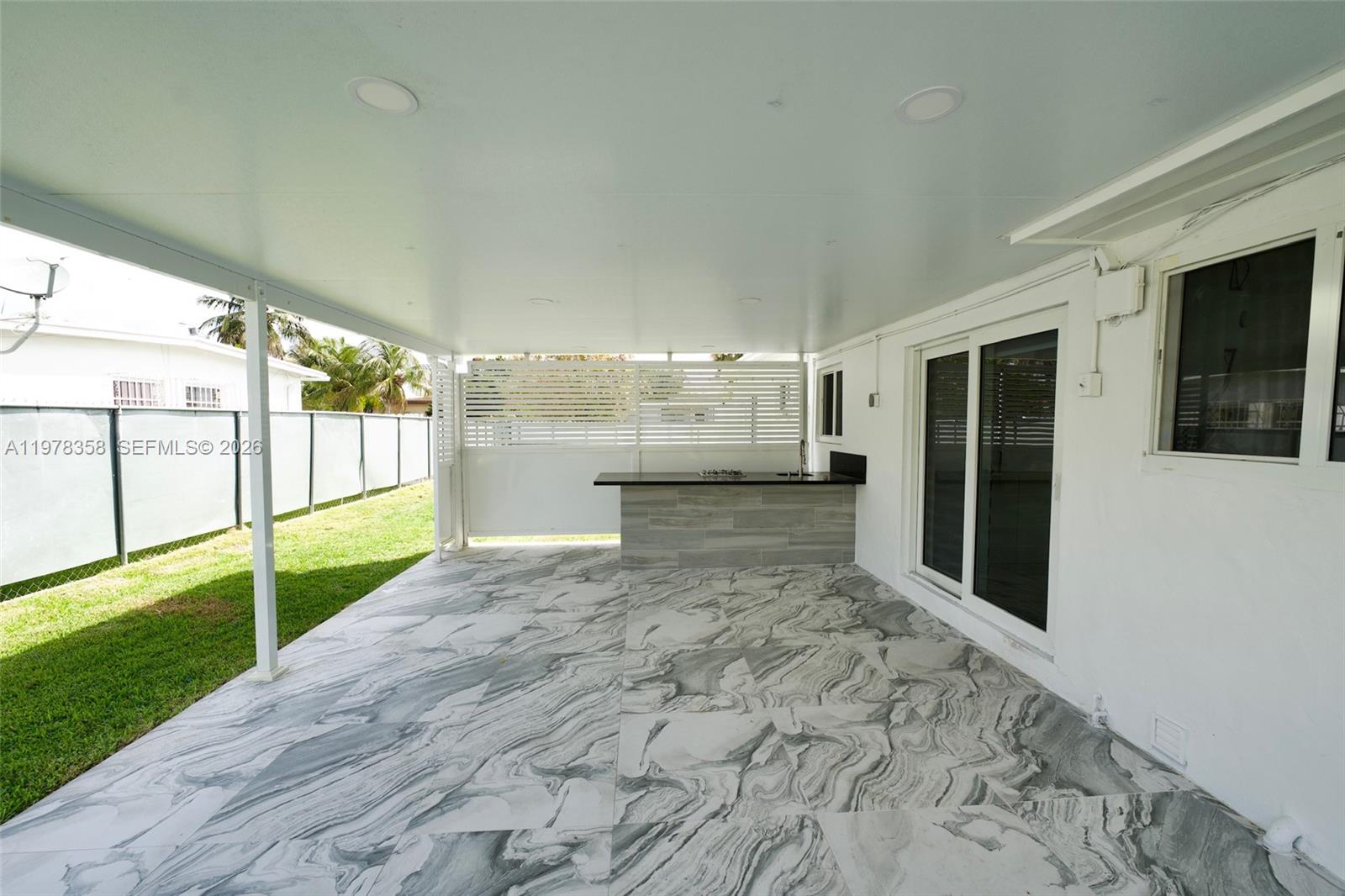 10381 Southwest 32nd Street Miami, FL 33165 - Photo 29 of 38 a view of a big room with wooden floor and brick walls