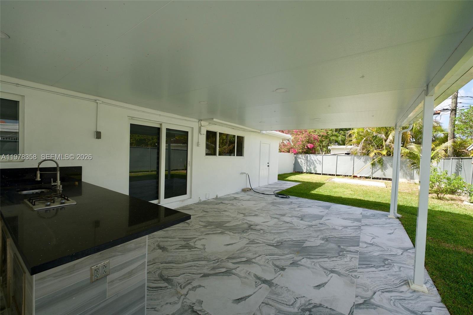 10381 Southwest 32nd Street Miami, FL 33165 - Photo 30 of 38 a view of backyard with a garden and yard