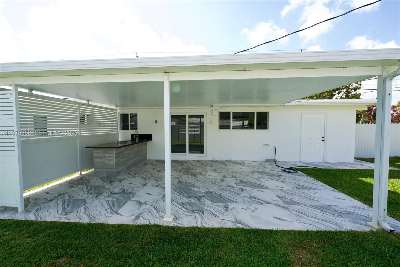 10381 Southwest 32nd Street Miami, FL 33165 - Photo 31 of 38 a view of a house with a patio