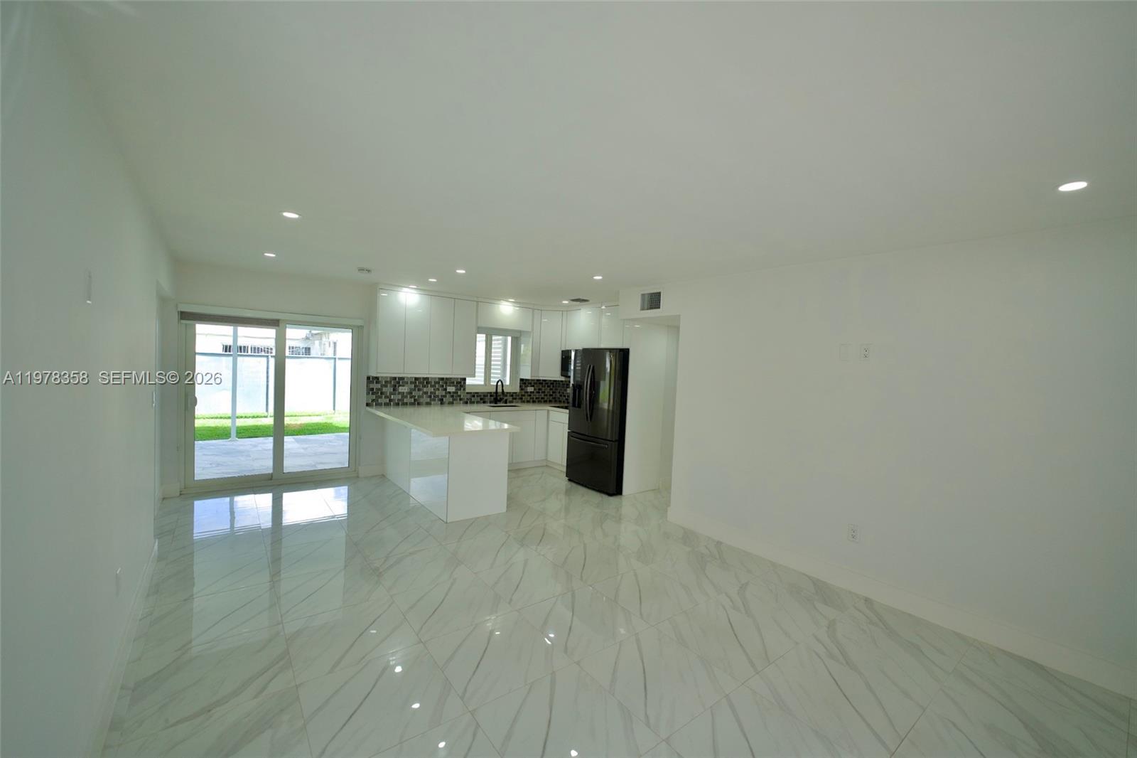 10381 Southwest 32nd Street Miami, FL 33165 - Photo 5 of 38 a view of an empty room and window