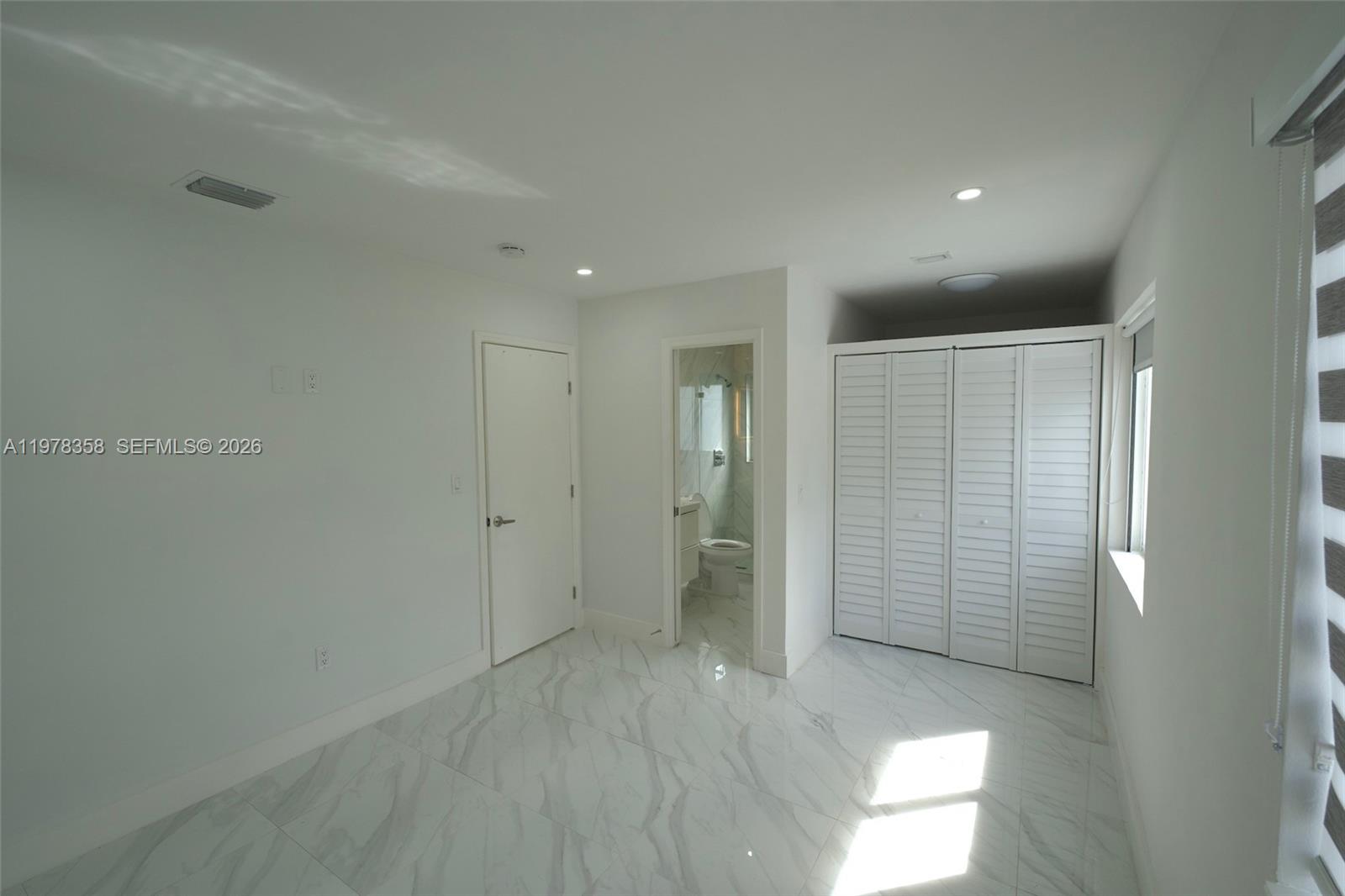 10381 Southwest 32nd Street Miami, FL 33165 - Photo 9 of 38 an empty room with a bathroom