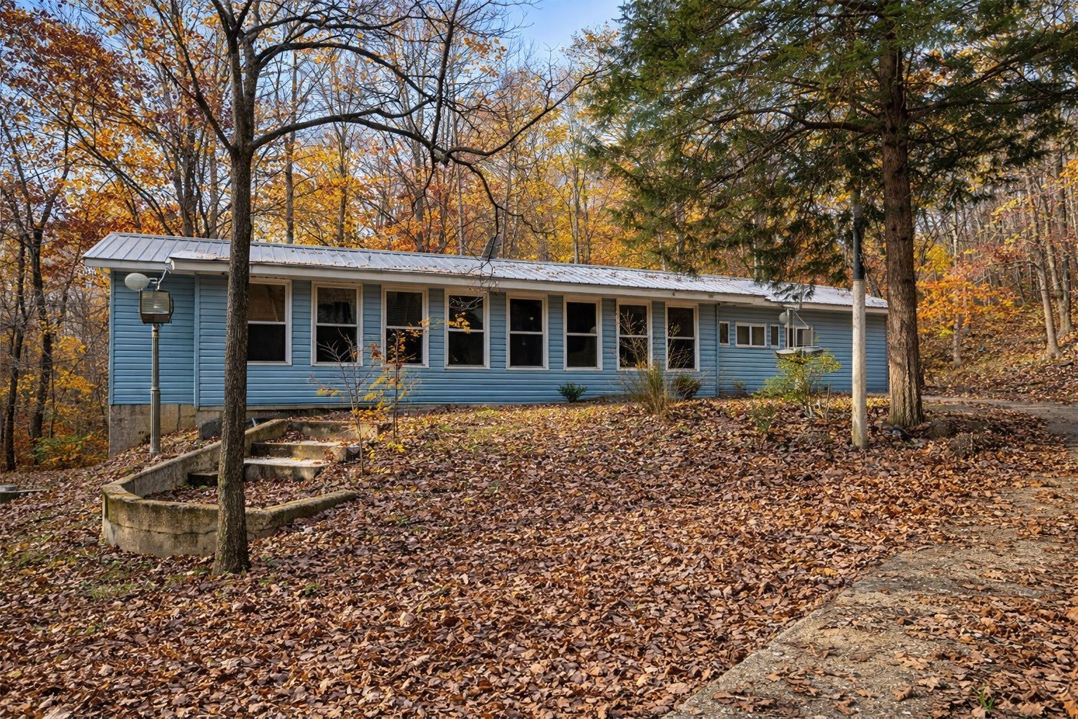 1135 West Mink Branch Road Waynesboro, TN 38485 - Photo 14 of 68 front view of a house with a tree