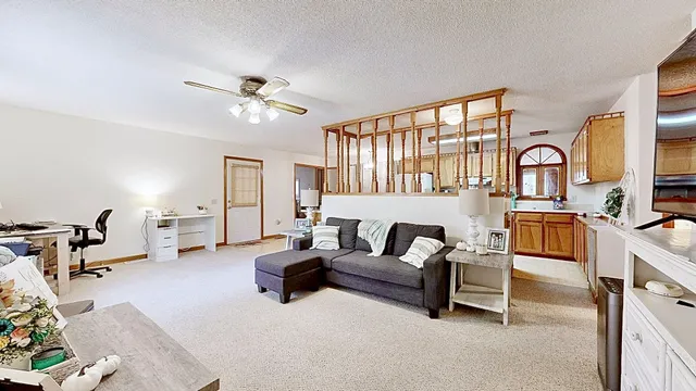 a kitchen with stainless steel appliances granite countertop a stove a refrigerator and a microwave