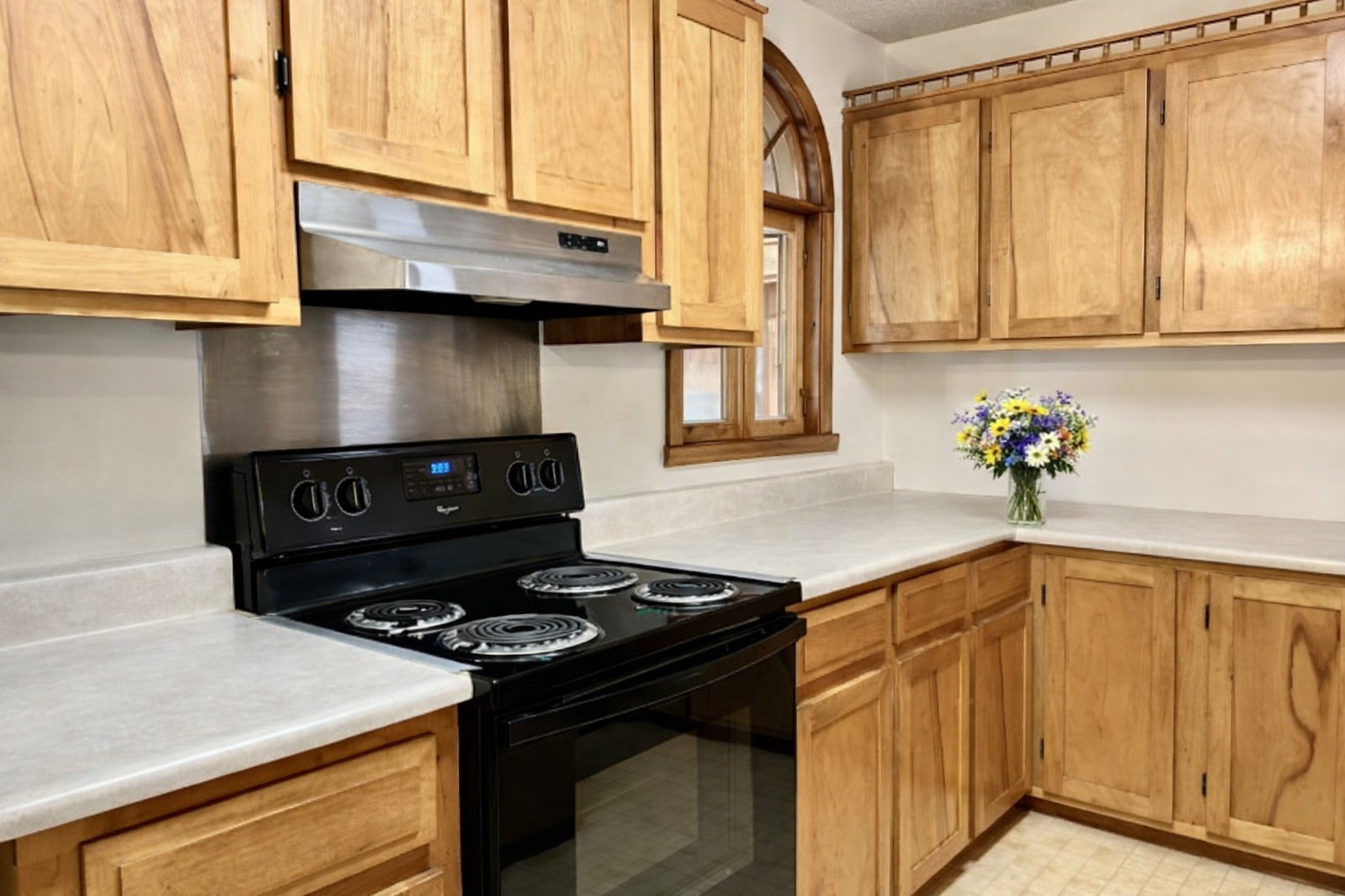 1135 West Mink Branch Road Waynesboro, TN 38485 - Photo 42 of 68 a kitchen with stainless steel appliances granite countertop a stove and a microwave