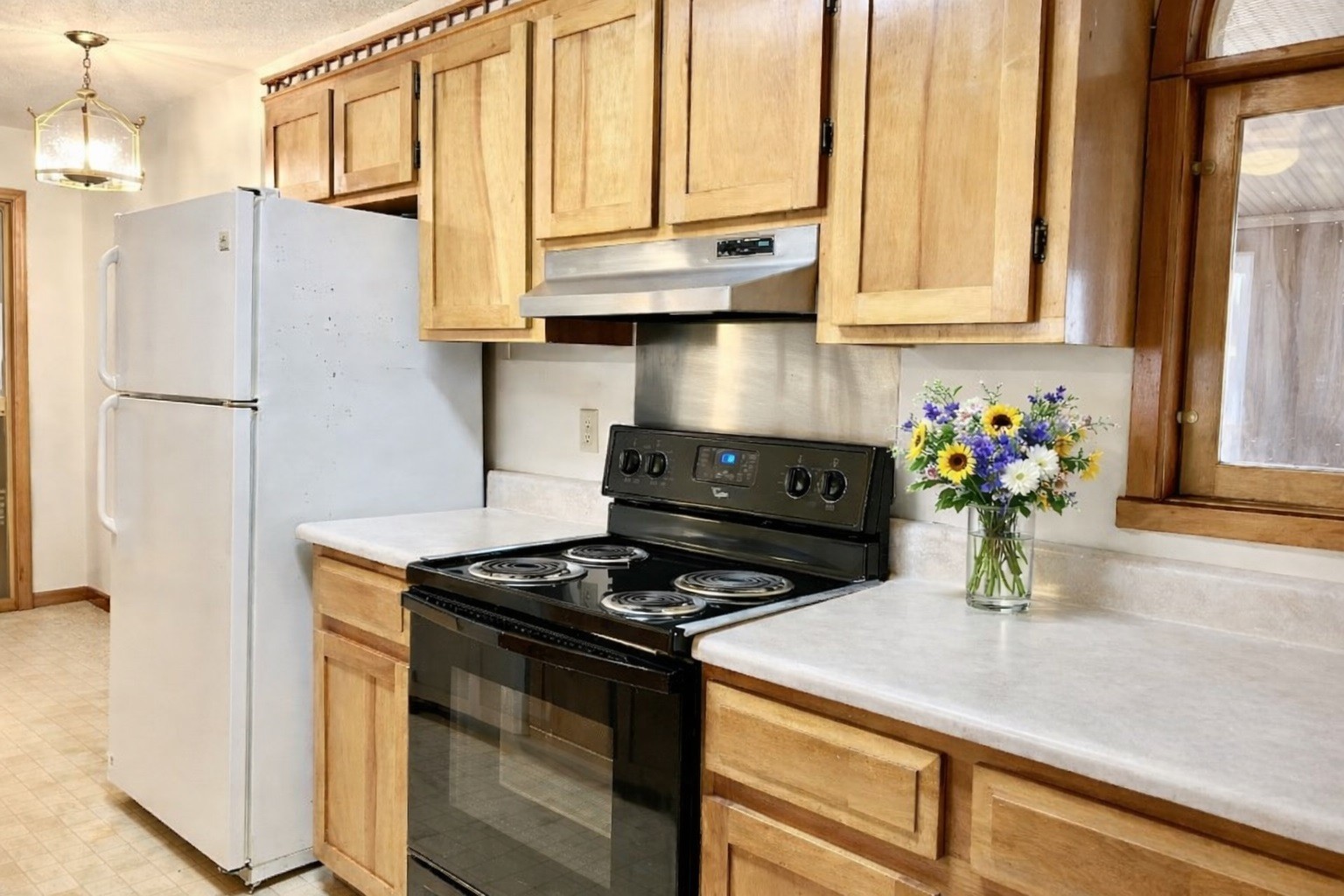 1135 West Mink Branch Road Waynesboro, TN 38485 - Photo 44 of 68 a kitchen with stainless steel appliances granite countertop a stove a refrigerator and a microwave