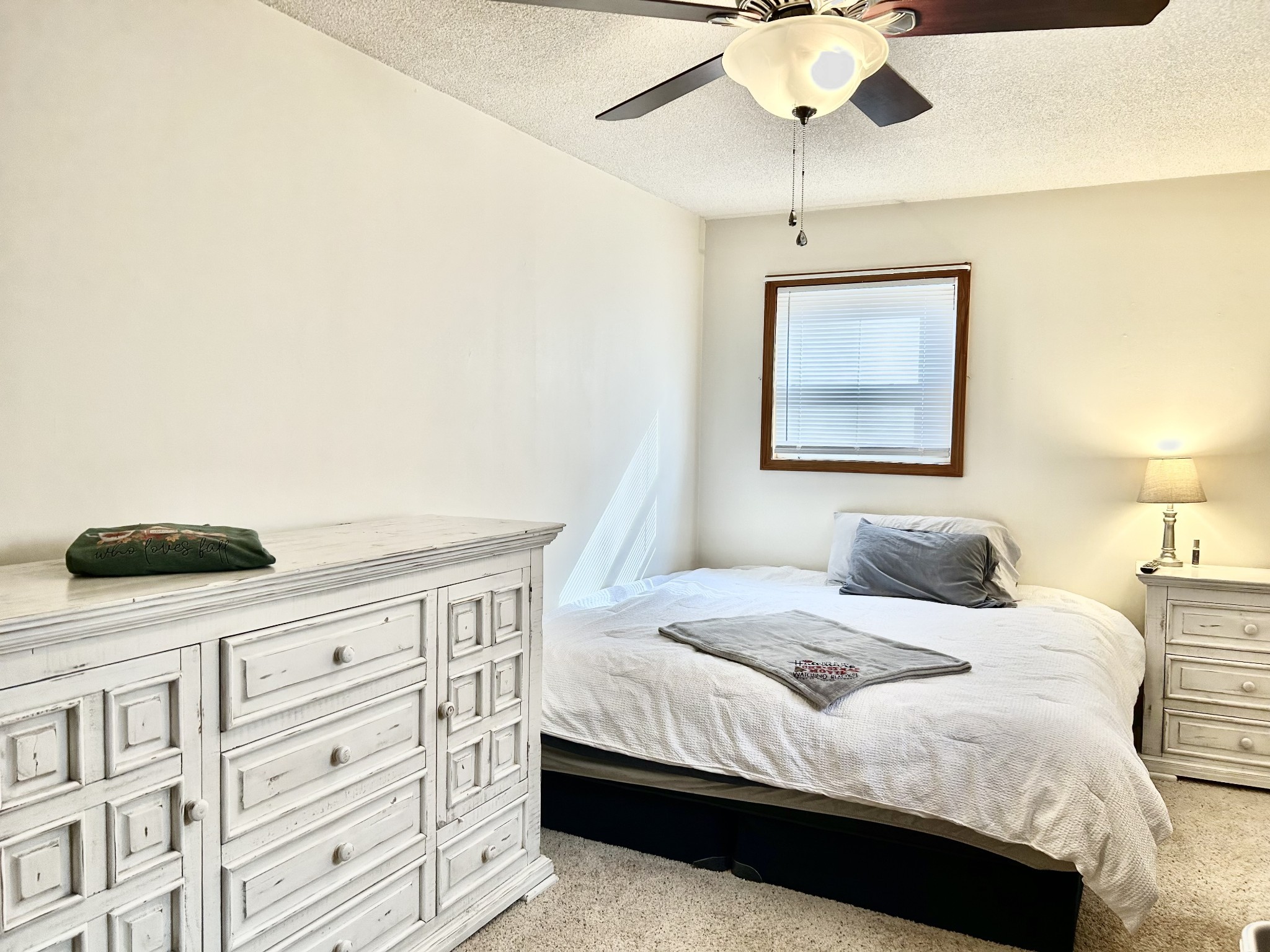 1135 West Mink Branch Road Waynesboro, TN 38485 - Photo 46 of 68 a bedroom with a bed and a chandelier