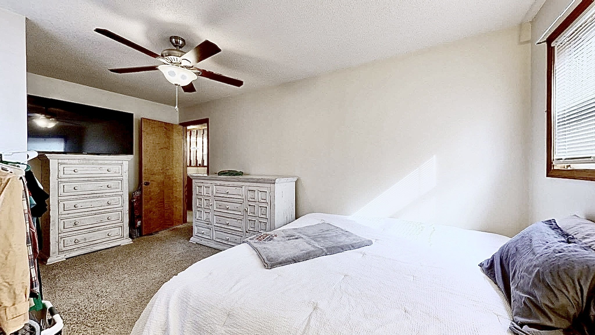 1135 West Mink Branch Road Waynesboro, TN 38485 - Photo 48 of 68 a bedroom with a bed and a flat screen tv