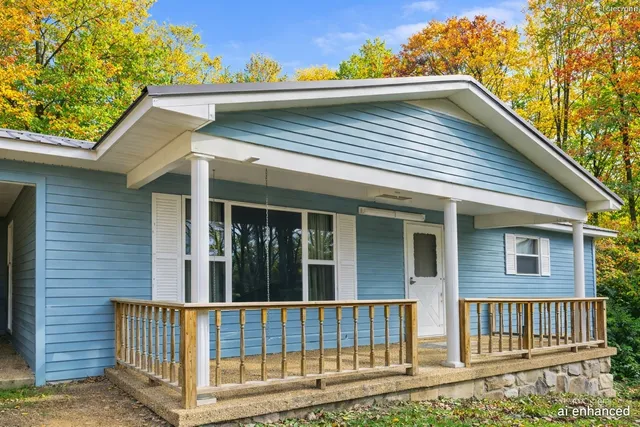 a view of a chairs and table in the balcony