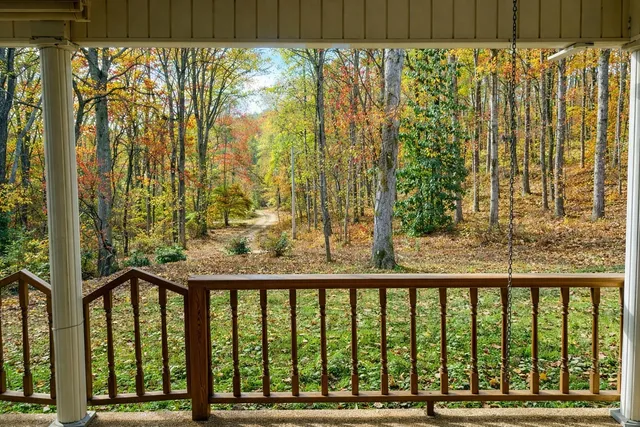 front view of a house with a tree