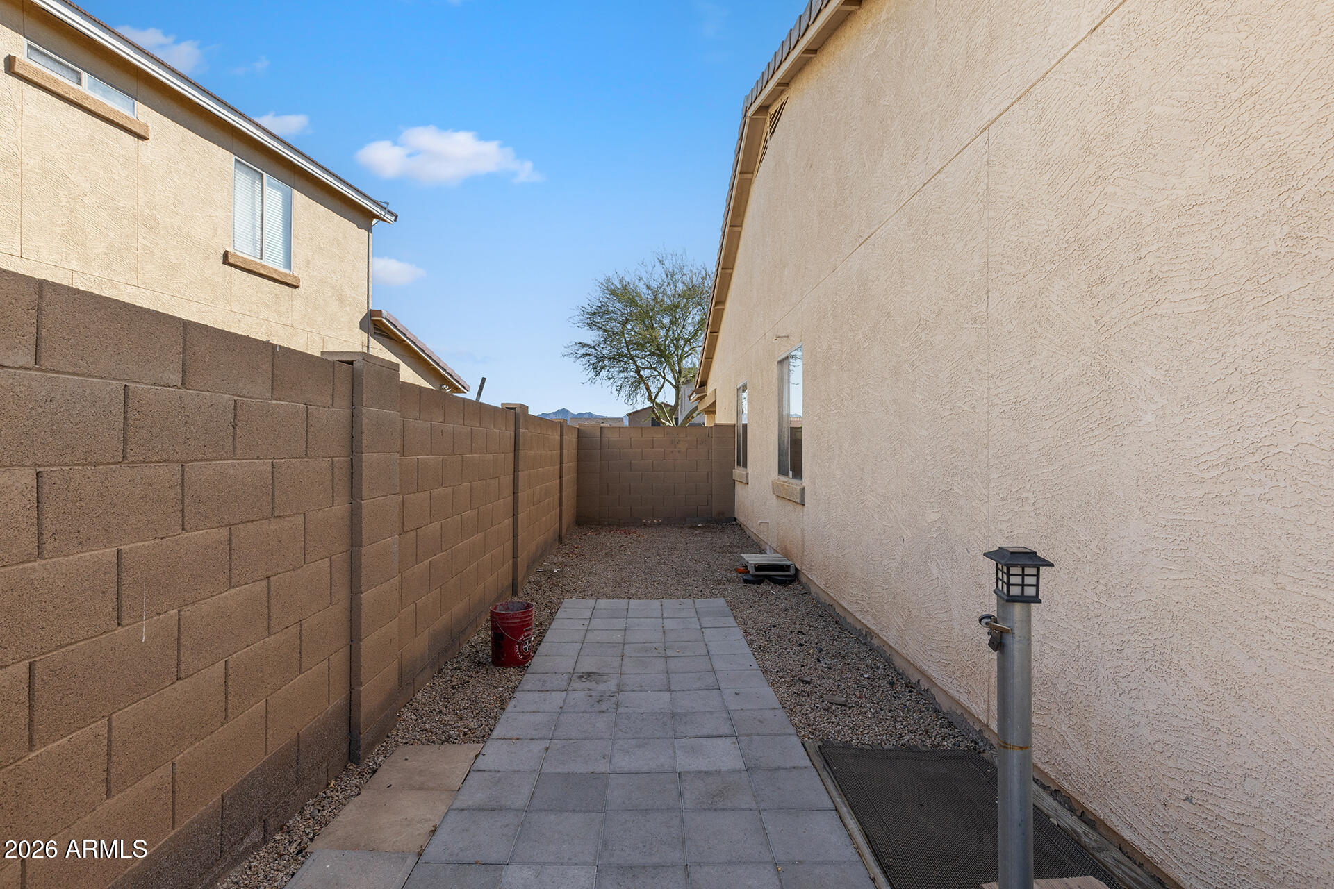 6718 West Darrel Road Laveen, AZ 85339 - Photo 42 of 49 a view of a pathway both side of house