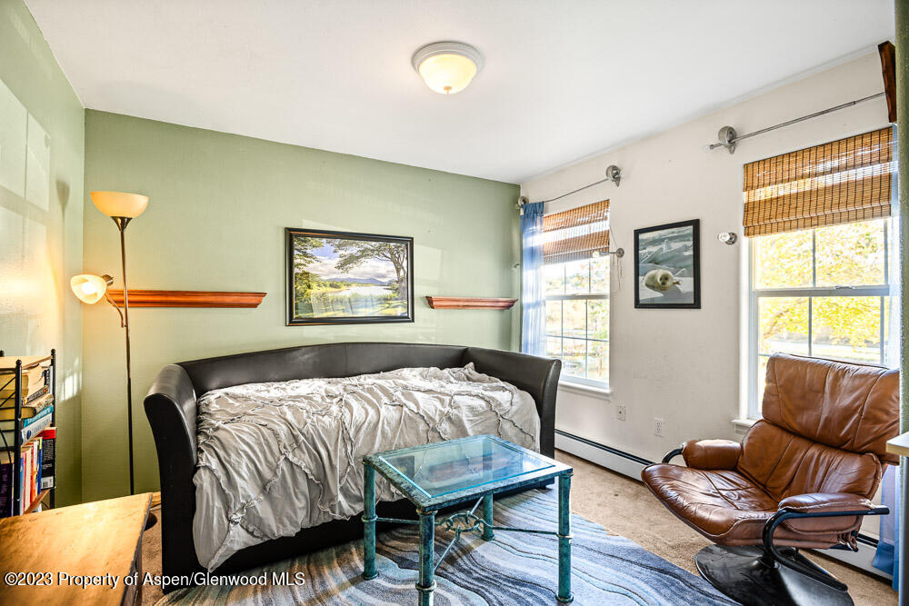2807 Acacia Avenue Rifle, CO 81650 - Photo 20 of 24 a bedroom with a bed and wooden floor