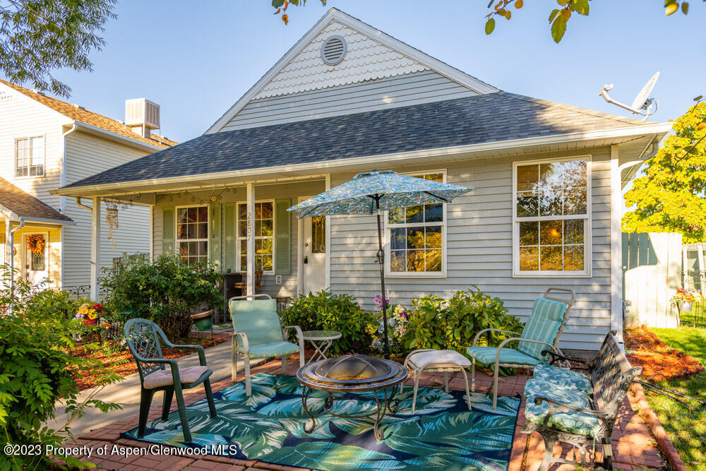 2807 Acacia Avenue Rifle, CO 81650 - Photo 5 of 24 a view of a chair and table in a patio front of house