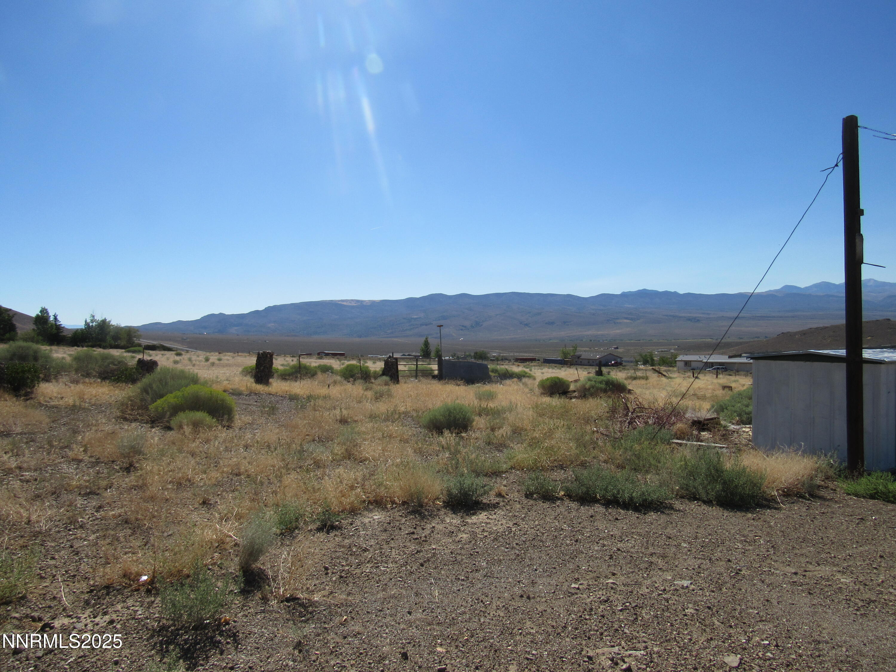 4151 Gray Hills Road Wellington, NV 89444 - Photo 13 of 25 a view of a lake with mountains in the background