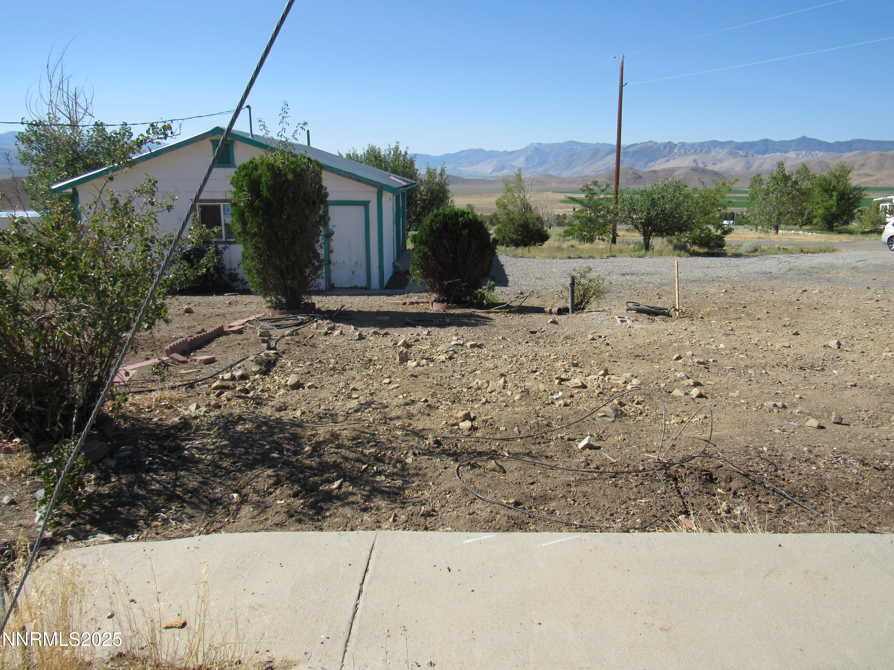 4151 Gray Hills Road Wellington, NV 89444 - Photo 16 of 25 a view of a dry yard with wooden fence