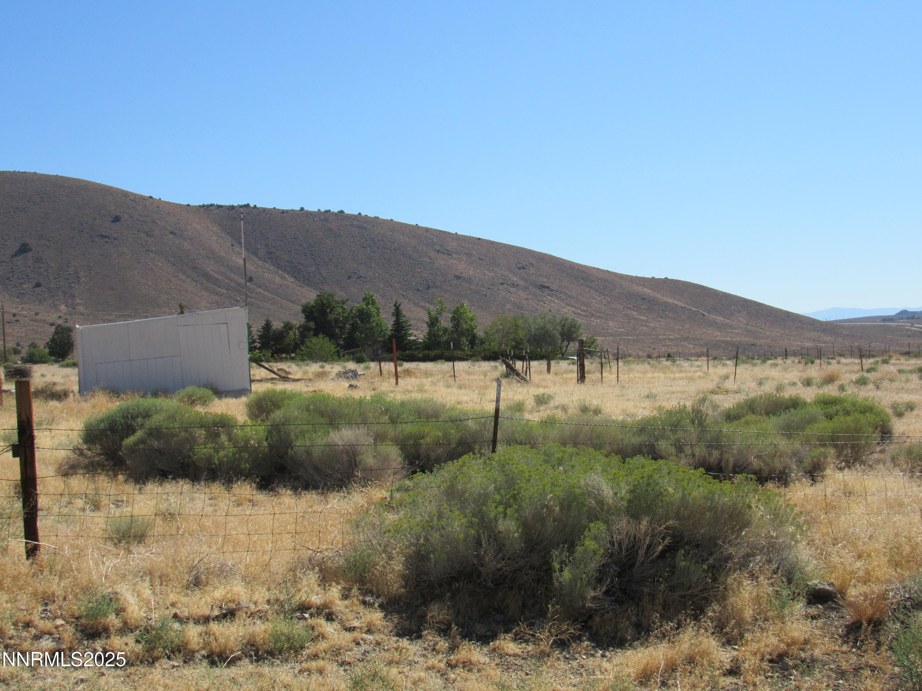 4151 Gray Hills Road Wellington, NV 89444 - Photo 19 of 25 a view of a dry field with green field