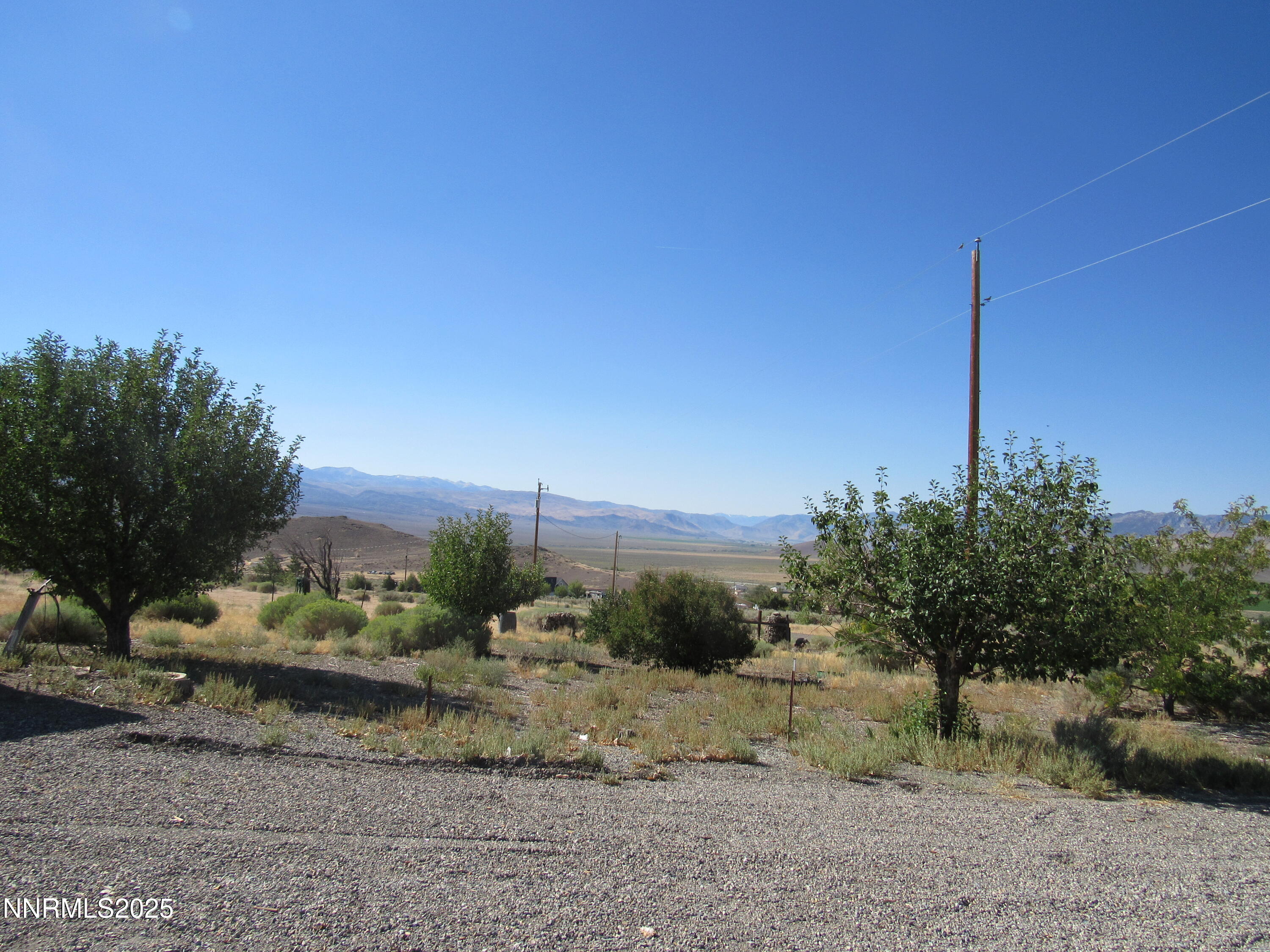 4151 Gray Hills Road Wellington, NV 89444 - Photo 2 of 25 a view of a dry yard with wooden fence