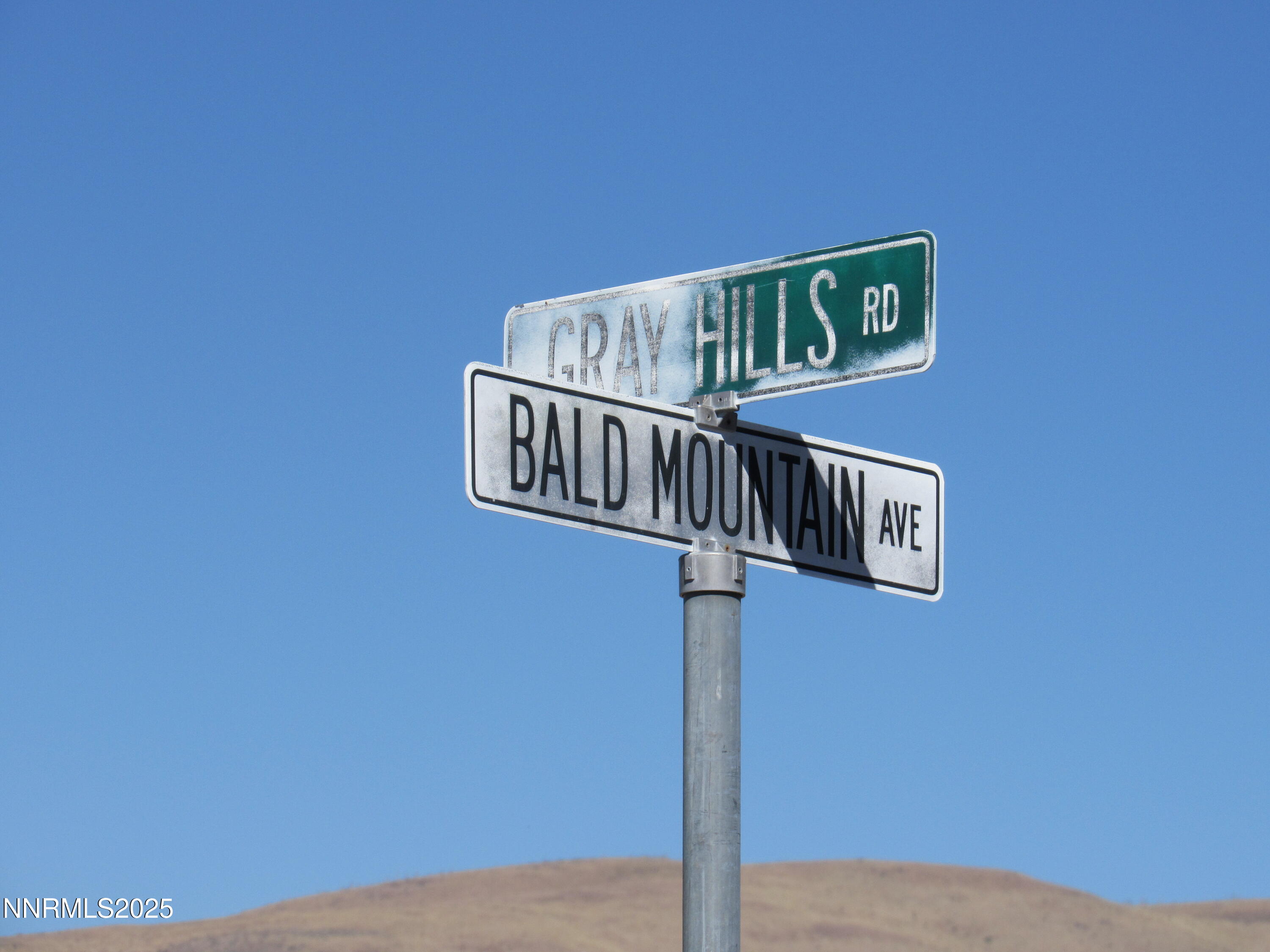 4151 Gray Hills Road Wellington, NV 89444 - Photo 25 of 25 a street sign sitting on a wall