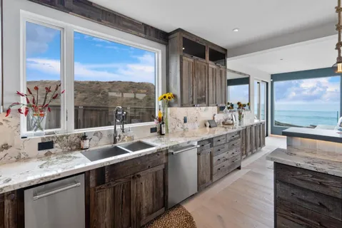 a room with lots of wooden furniture and a glass door