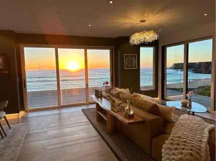 a living room with fireplace furniture and a fireplace