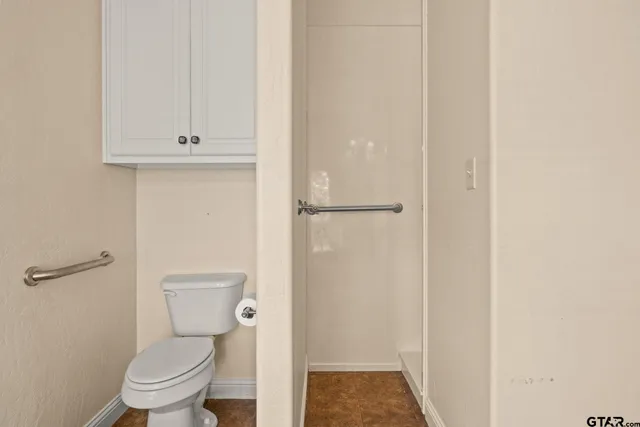 a view of a room with racks on the wall