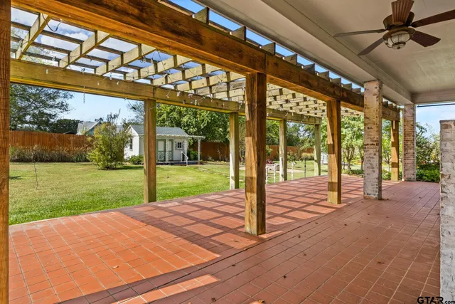 a view of a house with a backyard