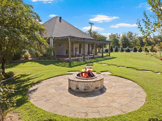 a view of a patio with a table and chairs