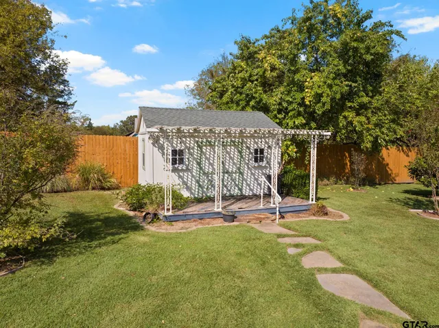 an aerial view of a residential houses with outdoor space