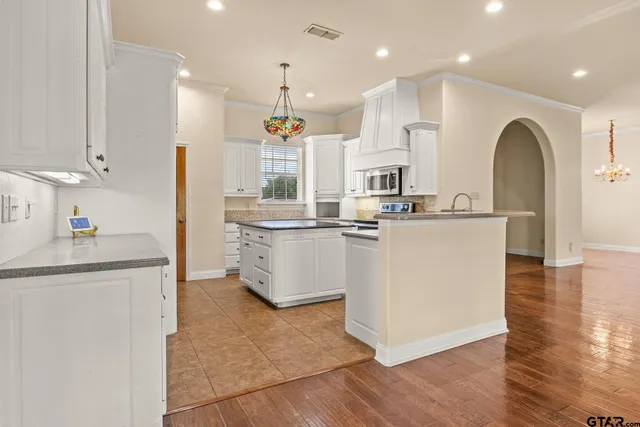 a view of cabinets and a window