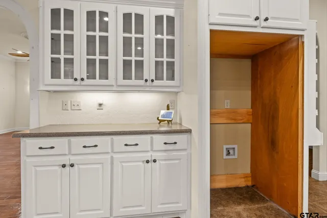 a kitchen with cabinets appliances and a sink