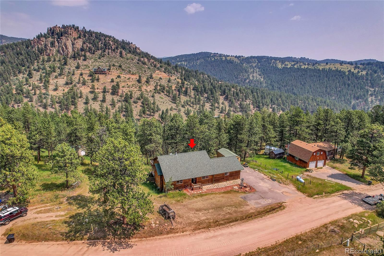 2063 Roland Drive Bailey, CO 80421 - Photo 2 of 49 a view of a road with a mountain in the background