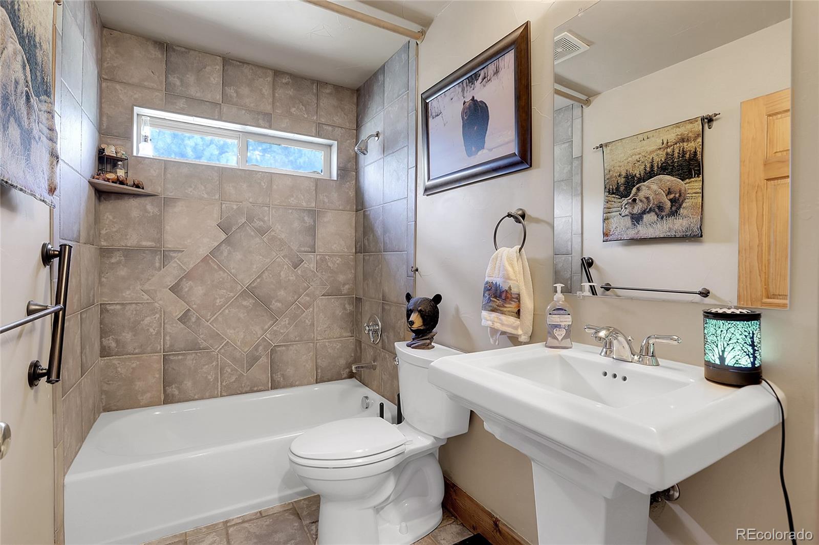 2063 Roland Drive Bailey, CO 80421 - Photo 21 of 49 a bathroom with a sink and a toilet