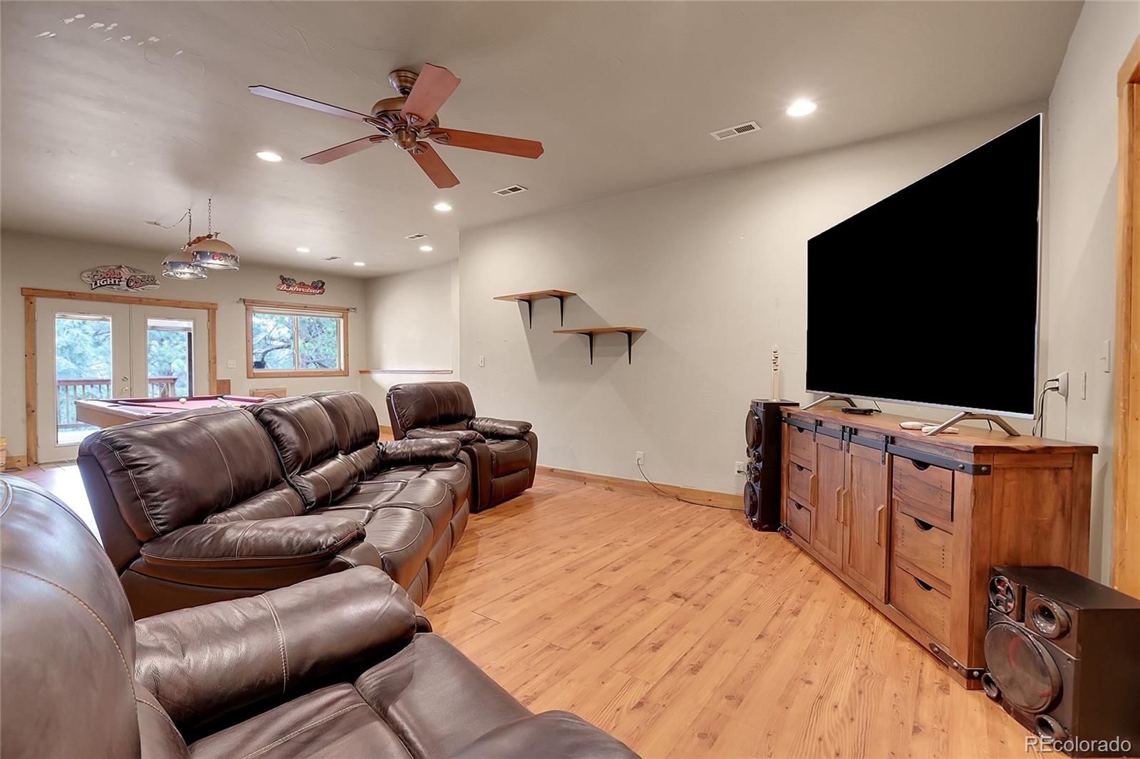 2063 Roland Drive Bailey, CO 80421 - Photo 34 of 49 a living room with furniture and a flat screen tv