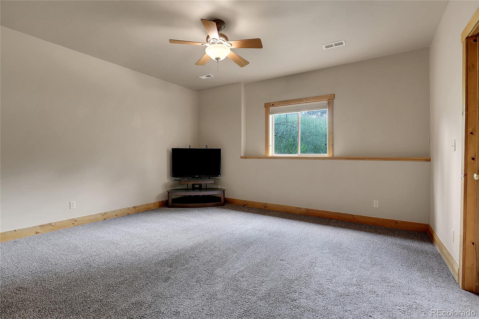 2063 Roland Drive Bailey, CO 80421 - Photo 35 of 49 an empty room with windows