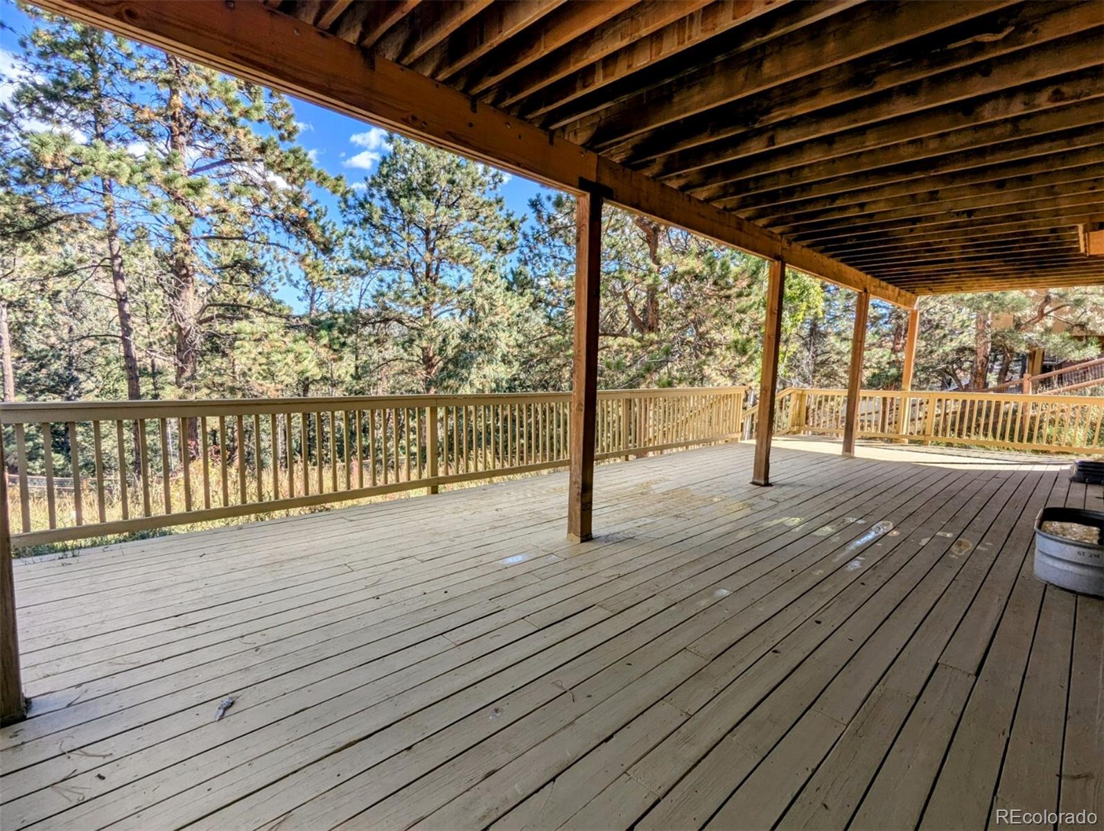 2063 Roland Drive Bailey, CO 80421 - Photo 40 of 49 a view of deck with wooden floor