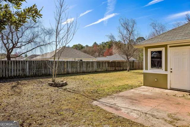 a swimming pool with wooden fence