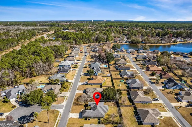 an aerial view of residential building and ocean