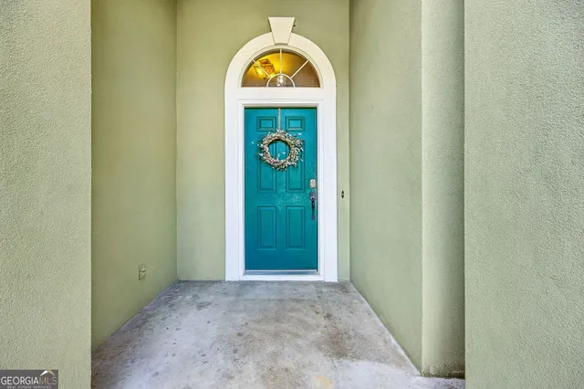a view of front door of stairs