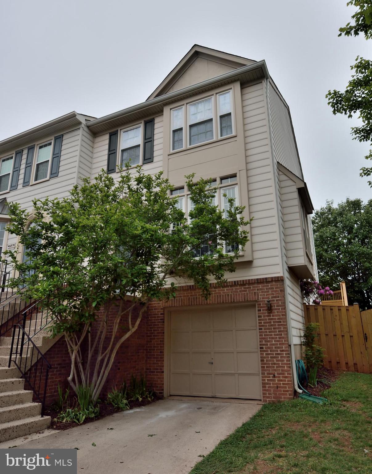 Welcome home to this stunning end-unit!