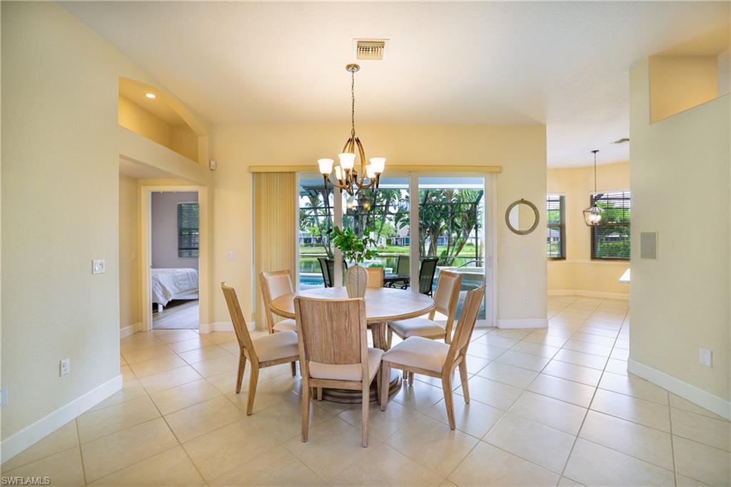 5235 Malvern Court Naples, FL 34112 - Photo 8 of 28 a view of a dining room with furniture window and outside view