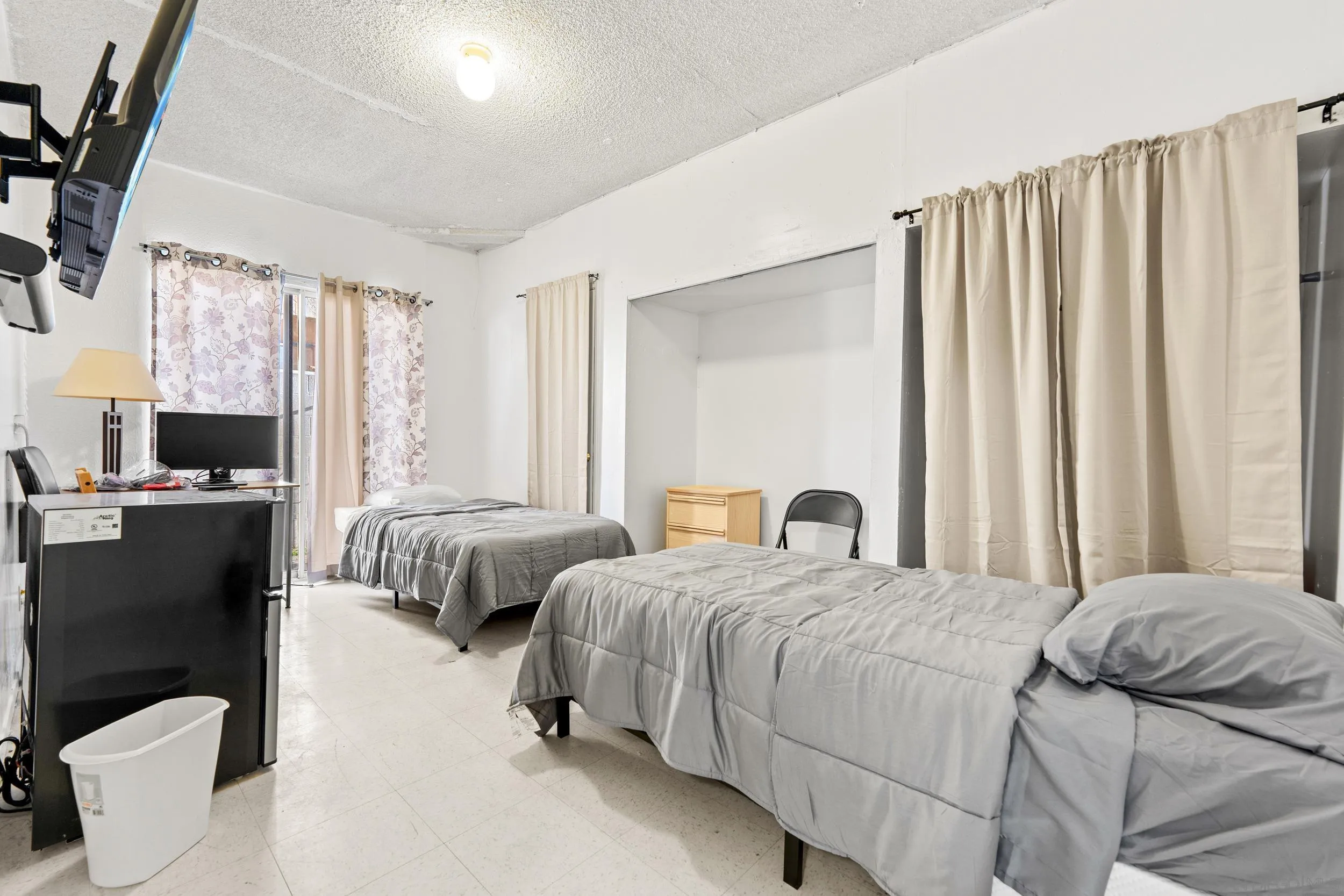 225 Deep Dell Road San Diego, CA 92114 - Photo 12 of 17 a bedroom with a bed and a couch