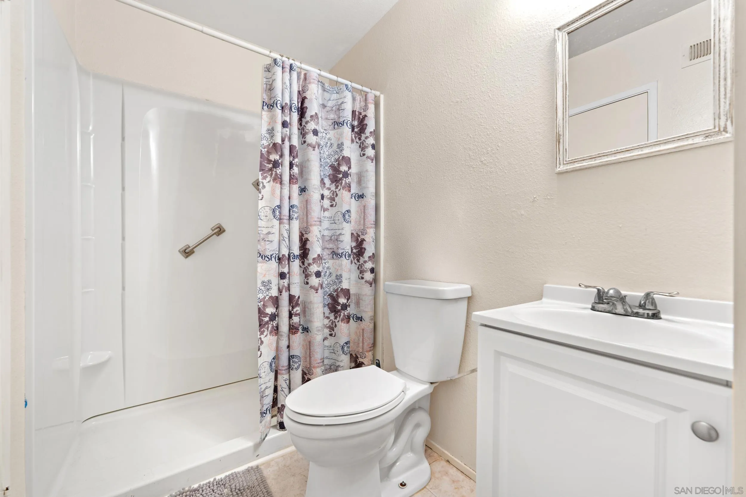 225 Deep Dell Road San Diego, CA 92114 - Photo 13 of 17 a white toilet sitting next to a bathroom sink