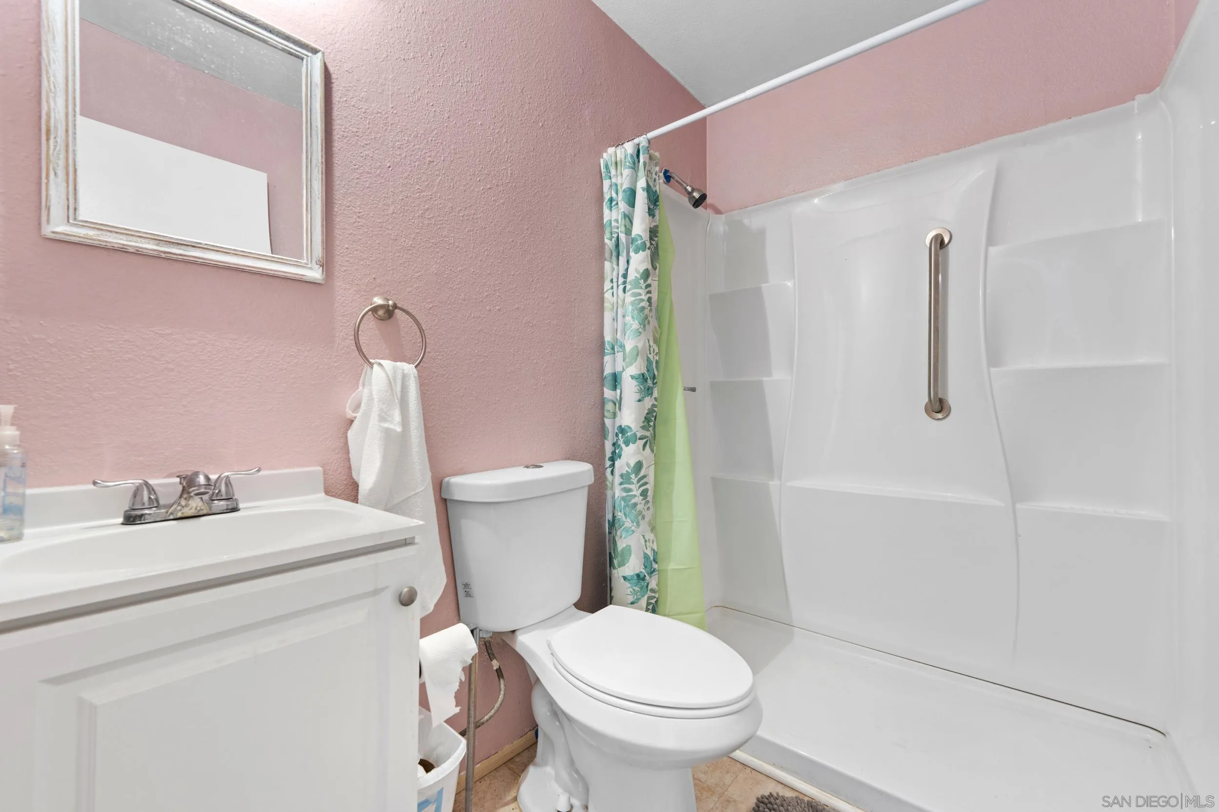 225 Deep Dell Road San Diego, CA 92114 - Photo 14 of 17 a white toilet sitting next to a bathroom sink