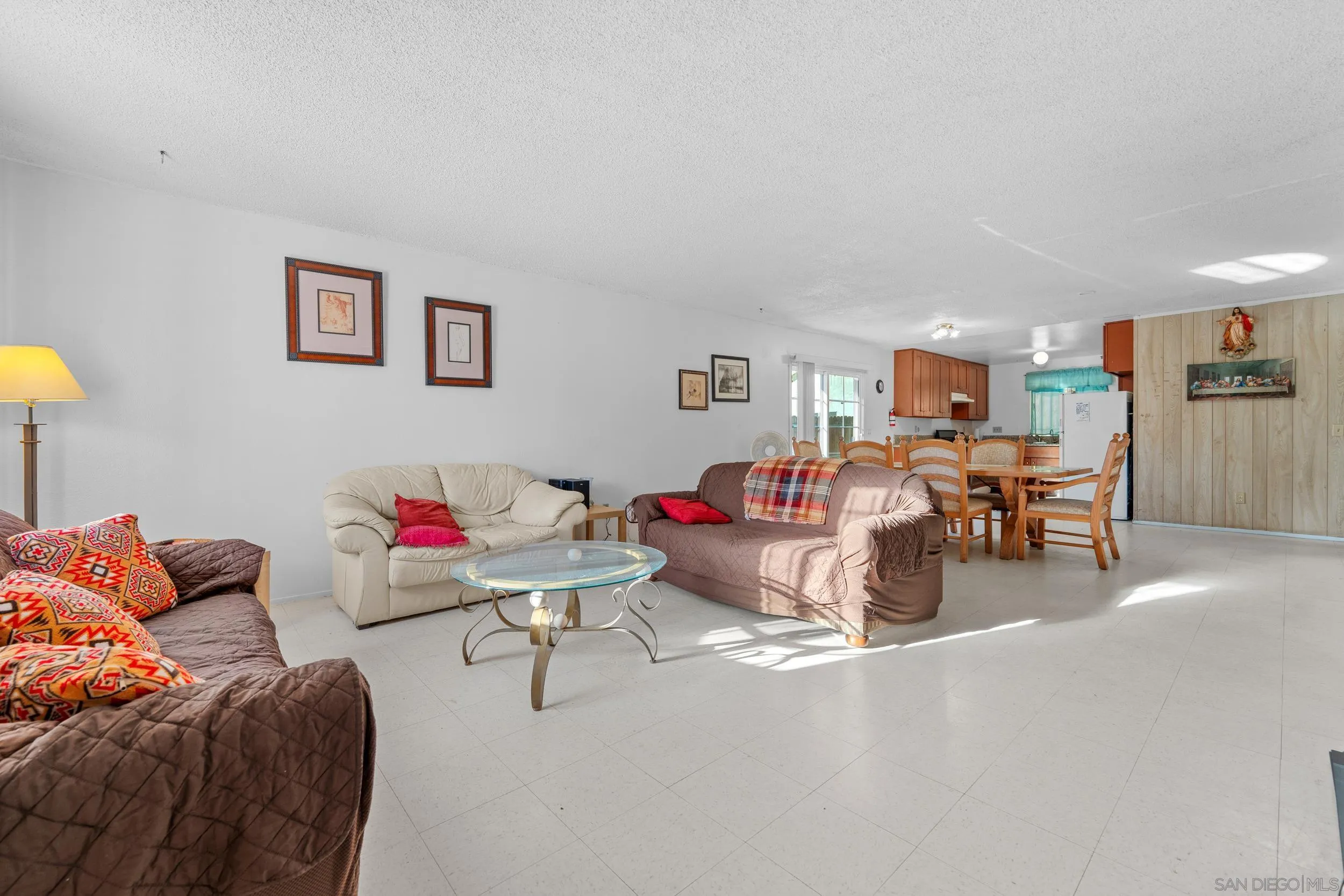 225 Deep Dell Road San Diego, CA 92114 - Photo 5 of 17 a living room with furniture and kitchen view