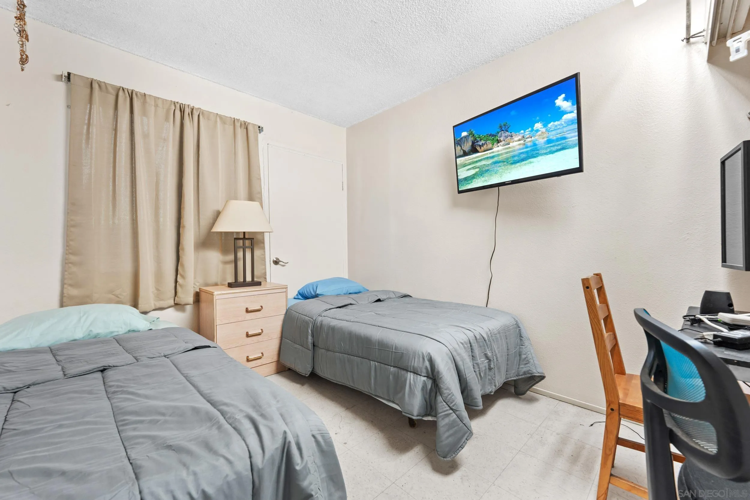 225 Deep Dell Road San Diego, CA 92114 - Photo 8 of 17 a bedroom with a bed and a painting on the wall