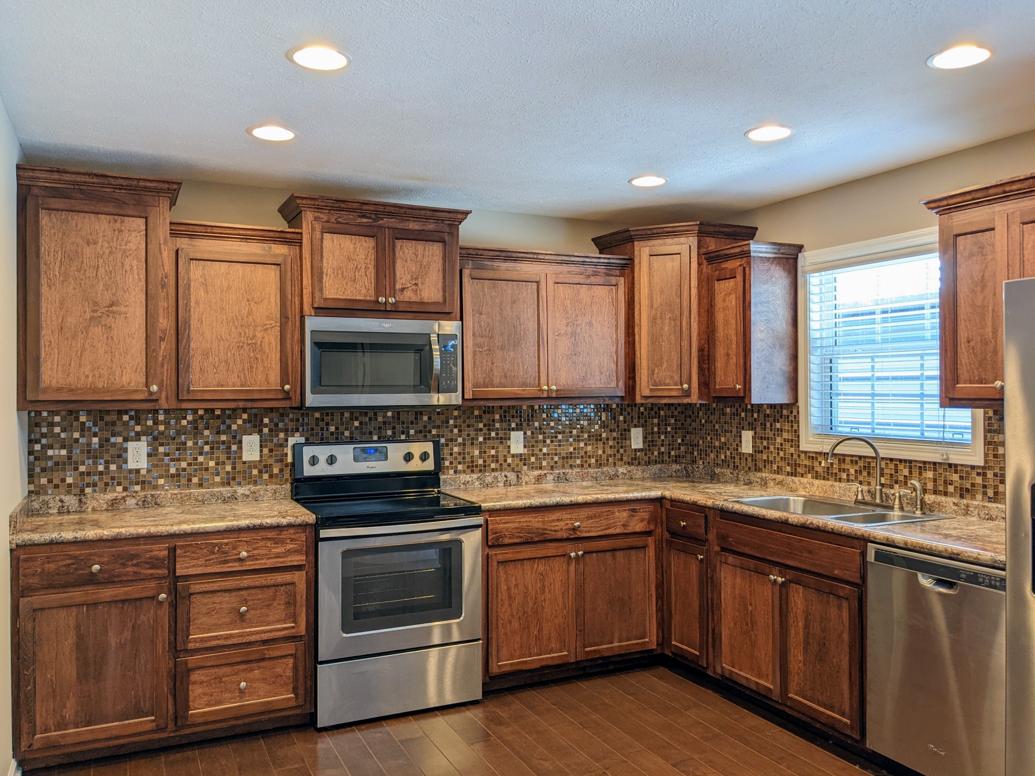 721 Marbury Road Tullahoma, TN 37388 - Photo 12 of 23 a kitchen with stainless steel appliances a stove sink and cabinets
