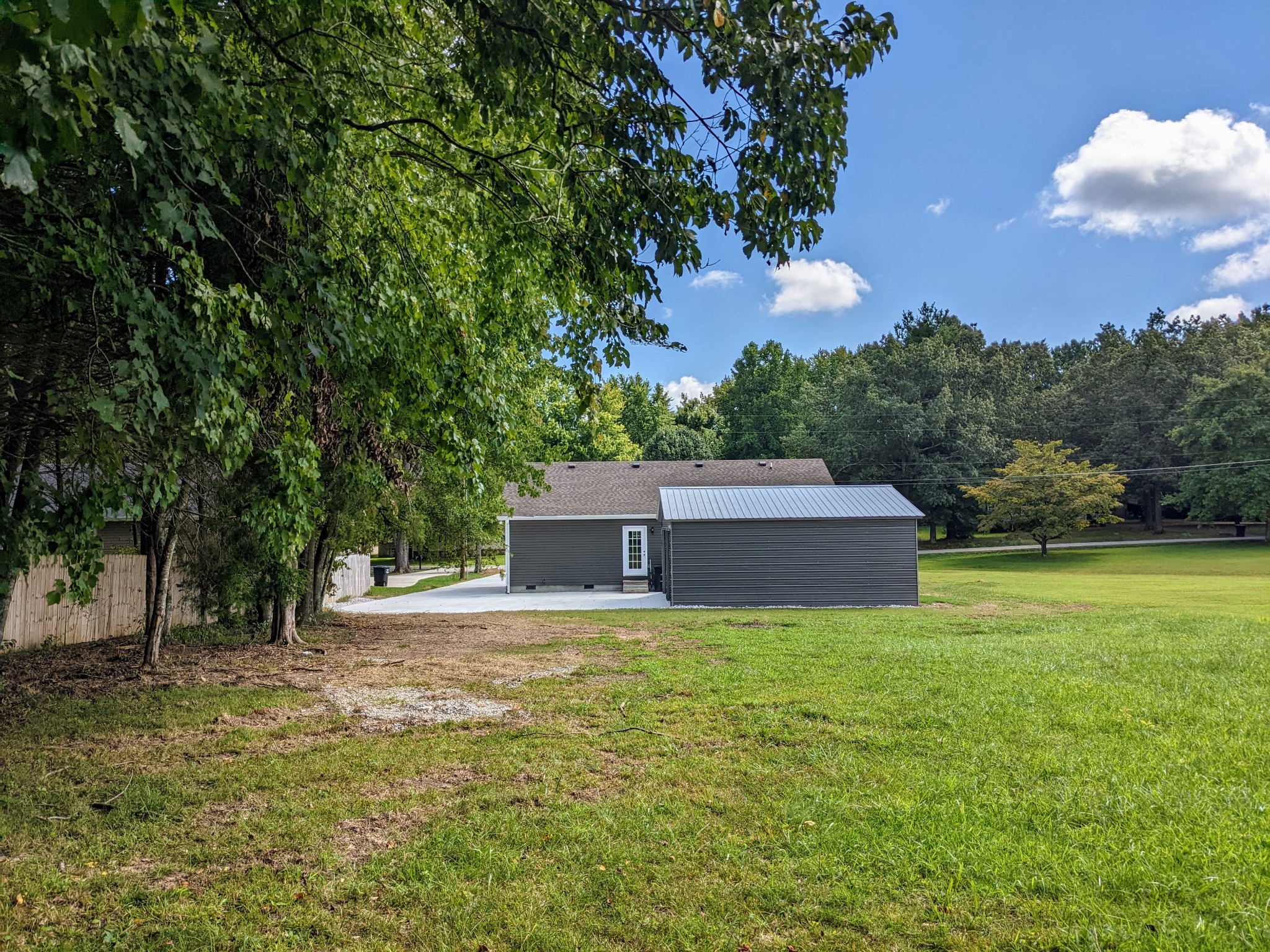 721 Marbury Road Tullahoma, TN 37388 - Photo 3 of 23 a white house that has a tree in front of it