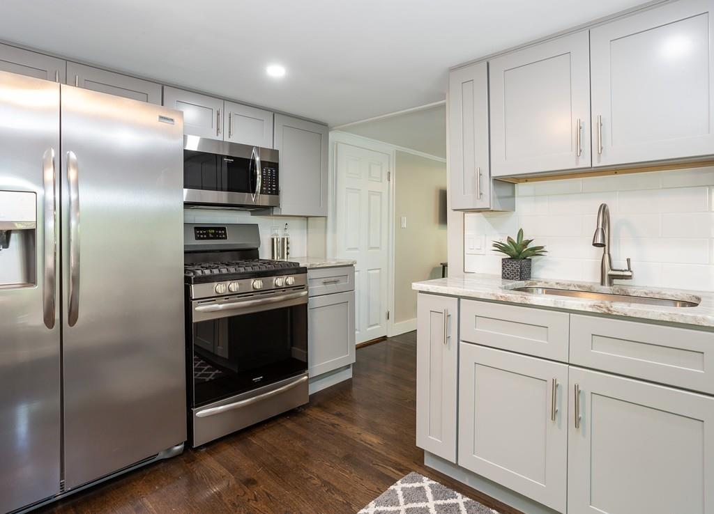 34 Plumtree Road Springfield, MA 01118 - Photo 1 of 22 a kitchen with stainless steel appliances a stove a sink and a refrigerator