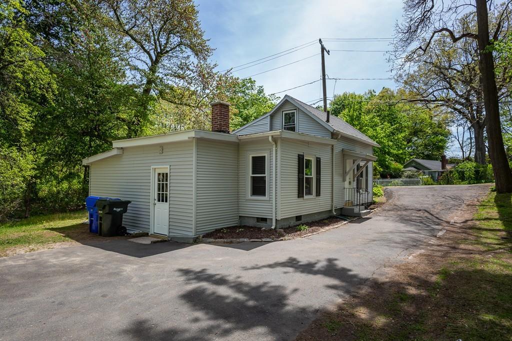 34 Plumtree Road Springfield, MA 01118 - Photo 12 of 22 a view of a house with a yard and a large tree