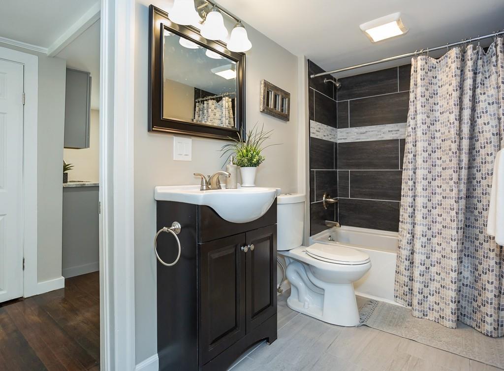 34 Plumtree Road Springfield, MA 01118 - Photo 14 of 22 a bathroom with a sink toilet and shower